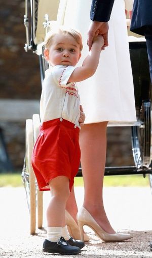 Prince George in his red-and-white tribute outfit at her sisters christening - July 2015.jpg